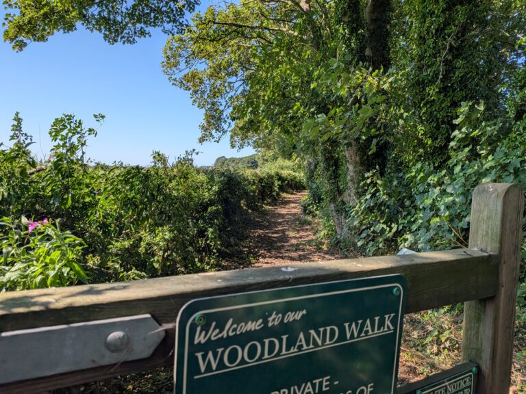 woodland walk sign on gate